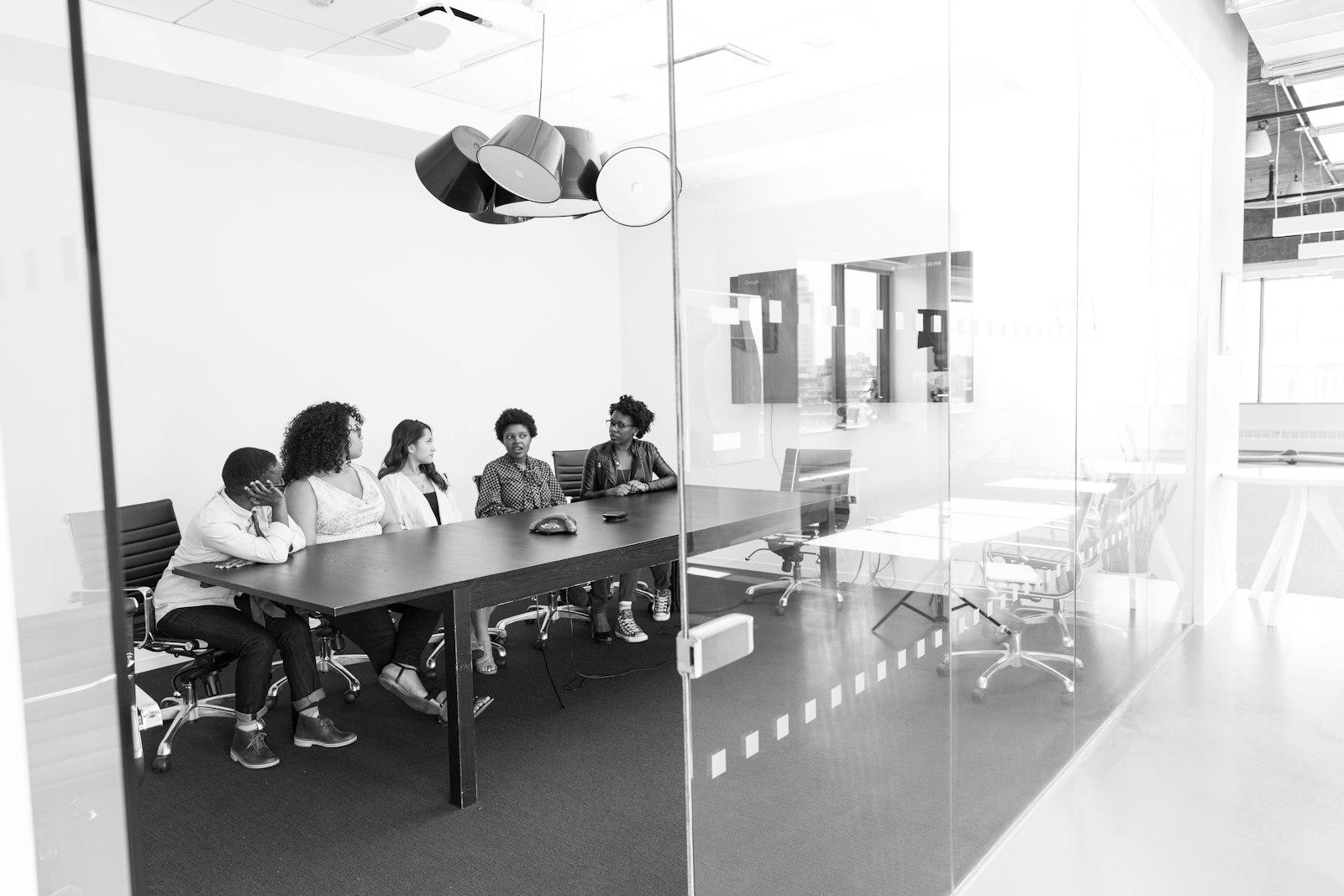 A board meeting in progress, the kind of room where an independent AI governance review gets presented.